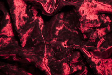 Deep red colored velvet plush background