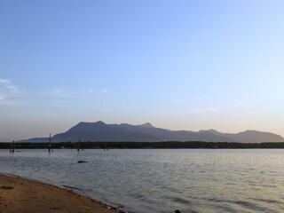 calm and peaceful scene at the river in early morning during sunrise