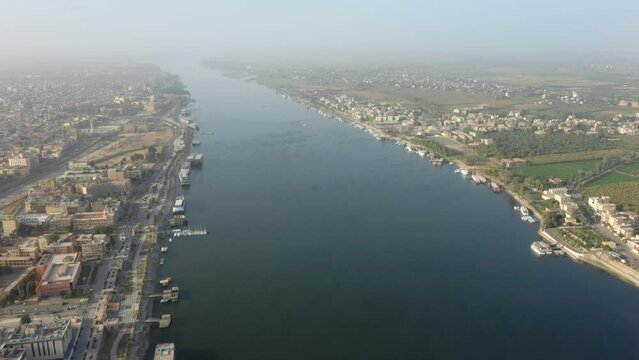 Aerial Drone shot of Nile River in Luxor at Sunrise