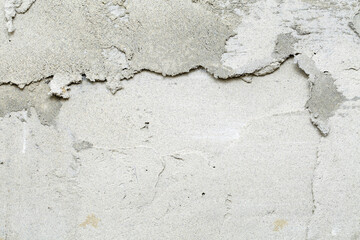Extreme close up of a fresh, rough putty on a wall. Construction industry background texture