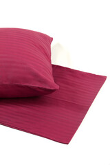 Corner of a soft pillow in a new colored cotton fiber pillowcase. Satin stripe material to protect and decorate the pillow. Bed linen for home and hotels