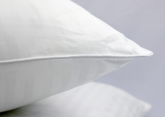 Cushion corner. White terry cotton fabric for mockup overlay design. Home textiles for the bedroom. Pillow with sewn-in piping around the edge.
