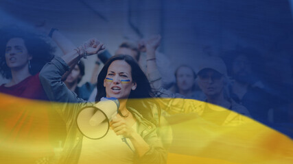 Double exposure of crowd of activists protesting against Russian military invasion in Ukraine walking in street and Ukrainian flag.