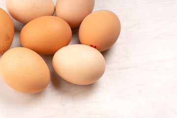 Organic chicken eggs on the table. Eggs are good for everyone and health. Farm products, natural eggs.