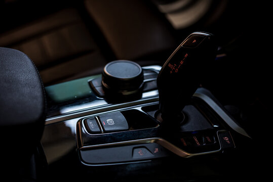 Automatic gear stick of a modern car, Control buttons. Car interior details.;