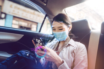 Identity scan young adult business asian woman wear face mask on taxi public transportation