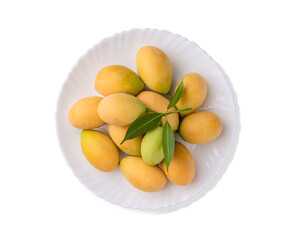 Fresh sweet and sour yellow Marian plums, plungo , popular Thai summer fruit on white plate and white background, studio shot, clipping path
