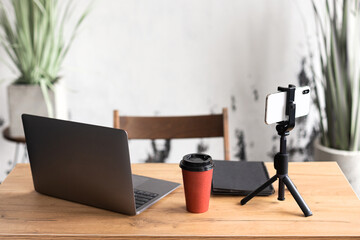 Comfortable workspace for office manager, business or freelancer in a stylish room with green...