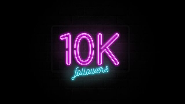 10K celebration neon sign on a brick wall