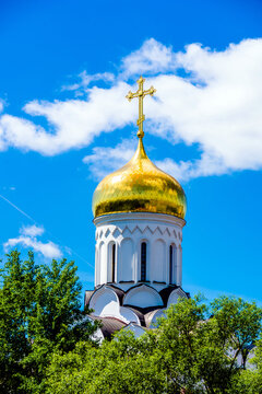 Domes of the Orthodox Church with crosses against the blue sky
