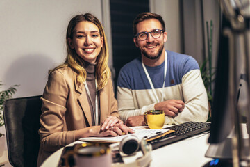 Couple working on new project. They working late into the night.