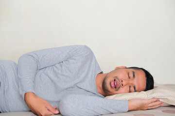 Side view of Adult Asian man sleep soundly