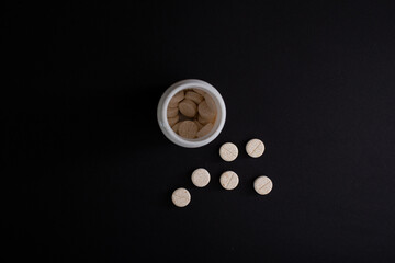 Pills, vitamins, medicine macro photo on background