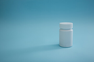 Medical packaging of pills on a blue background, a cure for the disease