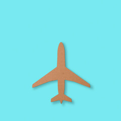 Cutout of an airplane over a blue background