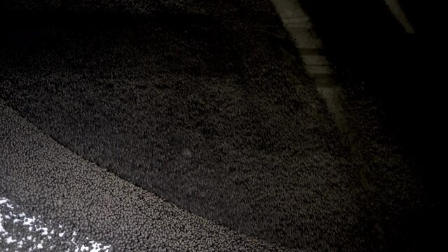 Production of iron ore pellets in pelletizer bowls. Part of the technological process for the processing of minerals. Raw material for metallurgy.
