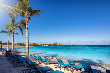 The beautiful Western Esplanade Beach at Nassau, Bahamas, with calm, turquoise sea and palm trees without people