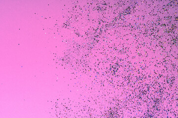 Gradient of multicolored sequins on a bright pink background, a great background for design, manicure,invitation, birthday, wedding, Valentine's Day,