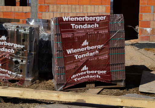 Wienerberger Tondach building material company ceramic roof tiles at construction site of a new single-family house. Unfinished stand-alone home under construction on March 8, 2022 in Krakow, Poland.