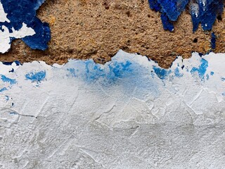 texture old concrete wall painted white and blue weathered cracks, abstract background