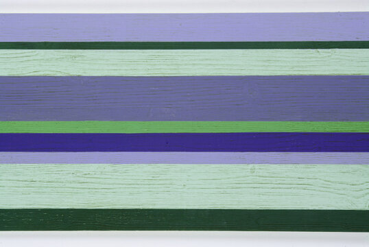 colored wooden background decoration with parallel stripes - cold tones
