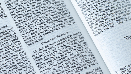 Open Holy Bible Book on biblical verses for salvation from God Jesus Christ. A closeup. The concept...