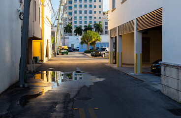 Puddle in a narrow backstreet in downtown Miami
