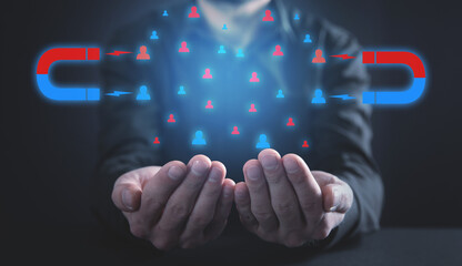 Man holding magnet attract customers. Business concept