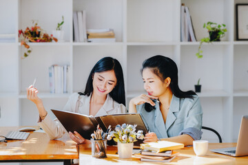 Consultation concept, contract signing, insurance, female employee holding a pen is offering contract documents to customers to sign important documents.
