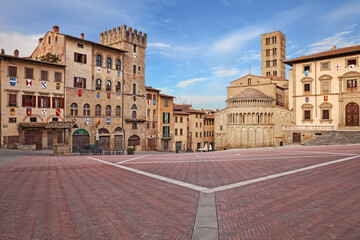 Arezzo, Tuscany, Italy: the main square Piazza Grande with the medieval church and buildings, in...