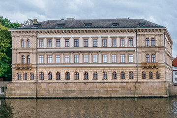 Fototapeta na wymiar view of a building on the Vltava river next to the city's bridges. Prague, Czech Republic