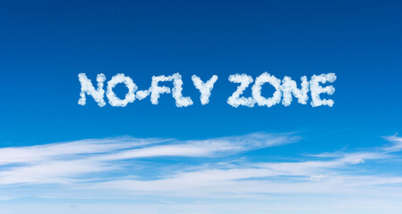Naklejka na ściany i meble No-fly zone word made of clouds on blue sky background