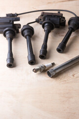 ignition coil packs and spark plug wires of gasoline engine with spark plug and a wrench, taken in...