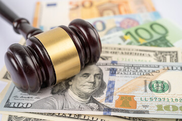 Judge hammer on US dollar and Euro banknotes. Financial development, Banking Account, Statistics, Investment Analytic  economy Business concept.