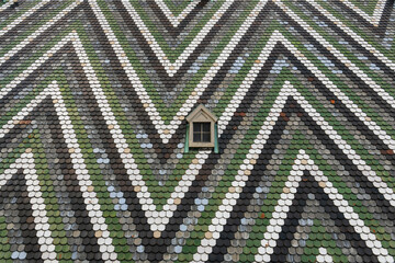 Fragment of a patterned tiled roof of St. Stephen's Cathedral Stephansdom in Vienna, Austria. January 2022