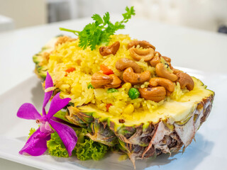 Fried rice in pineapple bowl in Thai style