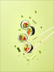 concept of flying vegan vegetables sushi and rolls levitation