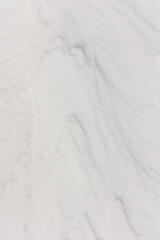 ripples in the snow formed by the strong wind from the mountain