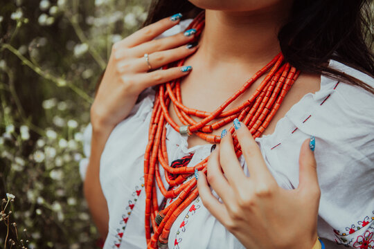 Ukrainian woman demonstrates ancient coral beads