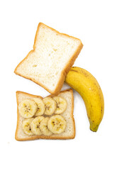 bread and bananas isolated on white background, selective focus