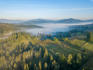 Morning fog in the Ukrainian Carpathians. Aerial drone view.