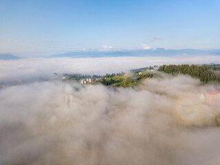 Morning fog in the Ukrainian Carpathians. Aerial drone view.