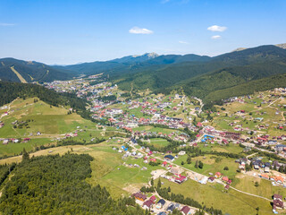Fototapeta na wymiar Mountain settlement in the Ukrainian Carpathians. Aerial drone view.