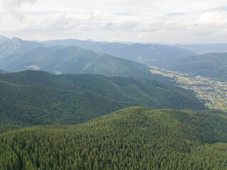 Green mountains of Ukrainian Carpathians in summer. Aerial drone view.