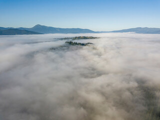 Morning fog in the Ukrainian Carpathians. Aerial drone view.
