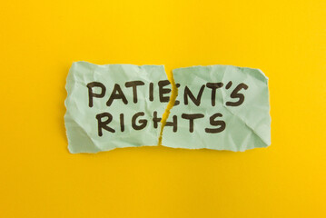 Words patient's rights handwritten on torn note