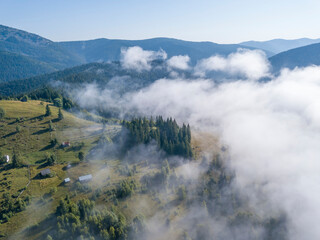 Morning fog in the Ukrainian Carpathians. Aerial drone view.
