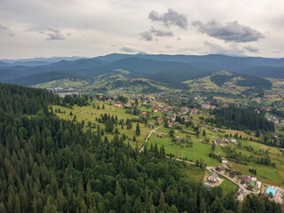 Settlement in the mountains of the Ukrainian Carpathians. Aerial drone view.