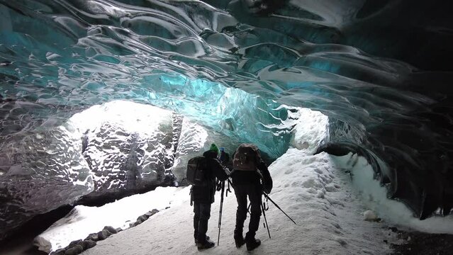 Ice Cave in Vatnajokull, Iceland.The beauty of the caves filled with blue ice. 