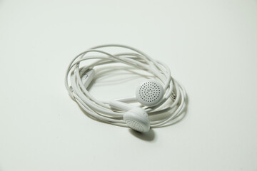 white wired headphones on a white background